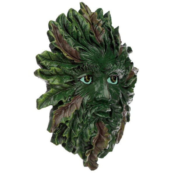 Green leafy mask with detailed facial features on a white background