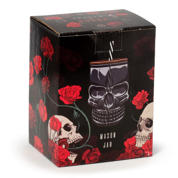 Skull-themed mason jar with decorative box featuring red roses on a white background