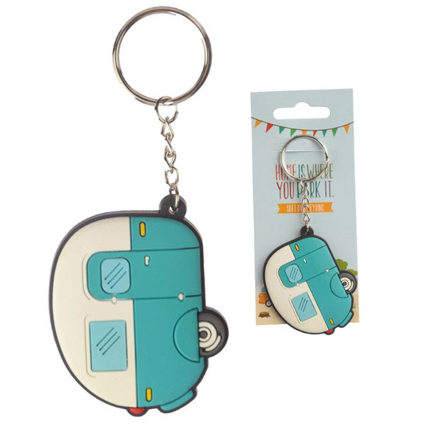 Teal and white camper-shaped keychain with packaging on a white background
