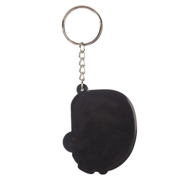 Black skull-shaped keychain on a white background