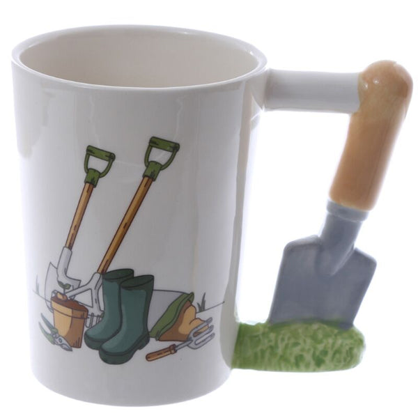 White mug with gardening-themed design including shovels, boots, and a pot on a white background