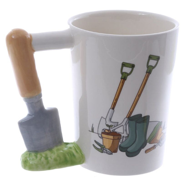 White mug with gardening-themed design and tools on a white background