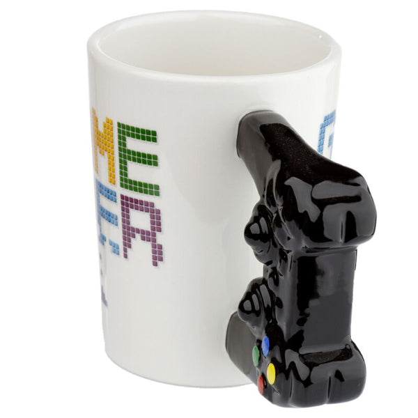 Mug with a black controller handle featuring colorful text on a white background