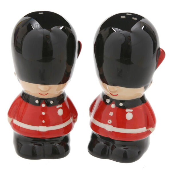 Two ceramic salt and pepper shakers in the shape of British guards on a white background
