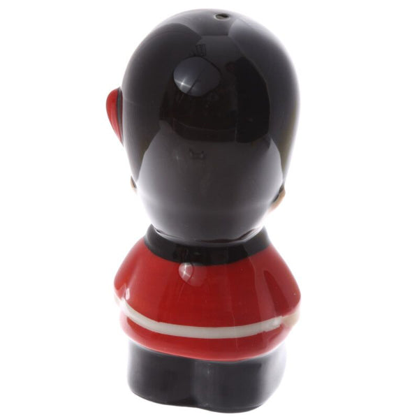 Black and red character figurine on a white background