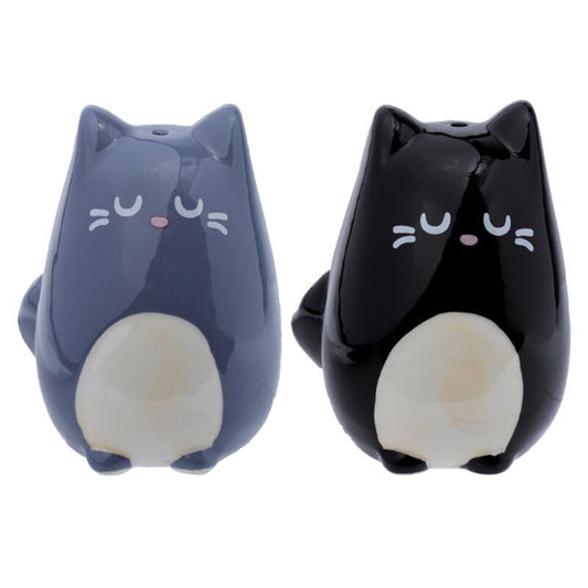Two cat-shaped salt and pepper shakers, one blue and one black, on a white background.