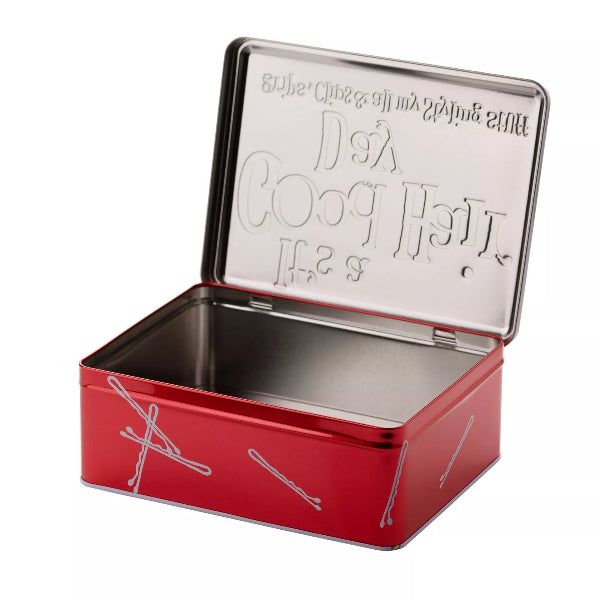 Red metal tin with silver lid on a white background