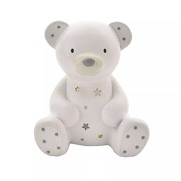 A white teddy bear night light with silver star cutouts and embroidered silver dots on its ears, snout, and paws, shown against a plain white background.