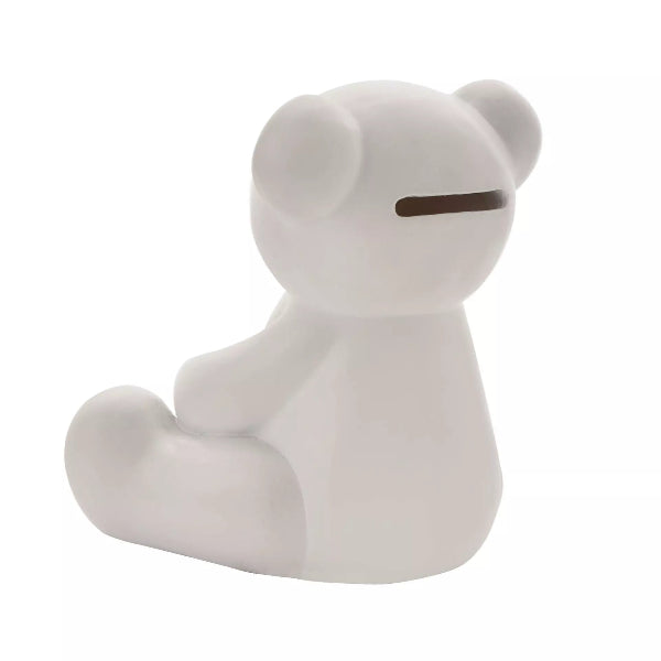 White ceramic bear-shaped object on a white background