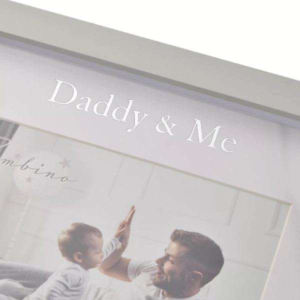 Framed photo of a man and child giving a high-five with 'Daddy & Me' text.
