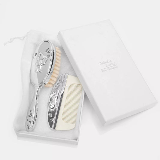 Baby grooming set with brush, comb, and mirror in a white box on a light gray background