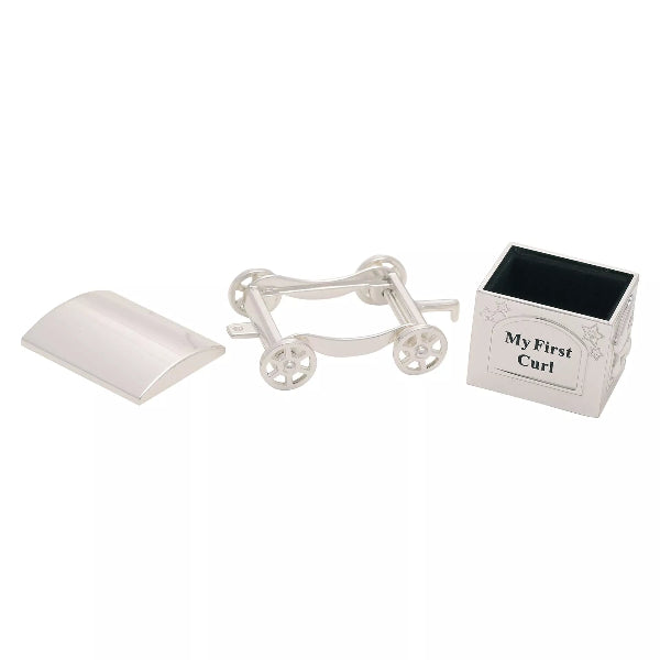White curling iron with a small box labeled 'My First Curl' on a white background