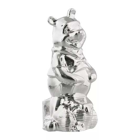 Silver teddy bear figurine on a white background