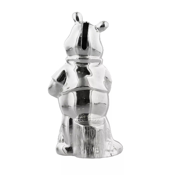 Silver chess piece shaped like a horse on a white background