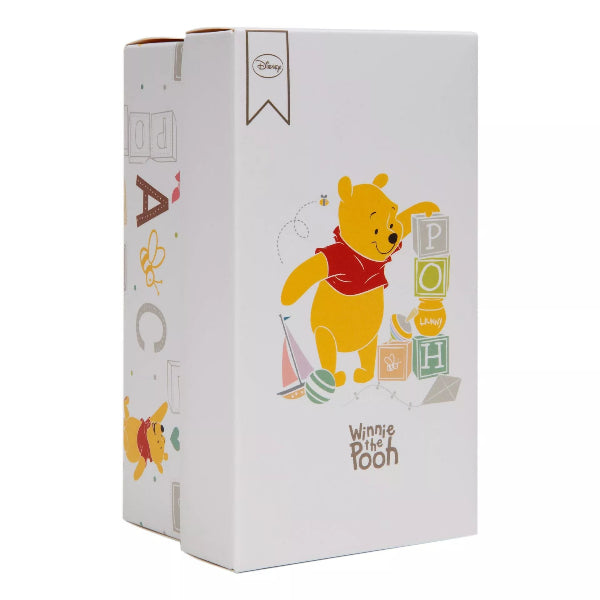 Winnie the Pooh-themed product packaging on a white background