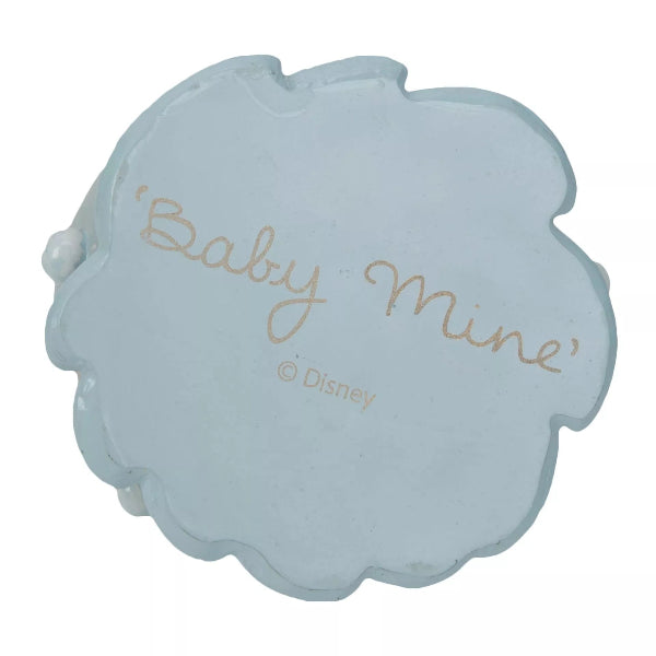 A light blue, cloud-shaped keepsake box with scalloped edges, featuring the words "Baby Mine" in gold cursive and the Disney copyright logo printed below, set against a plain white background.