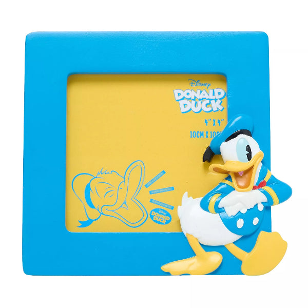 Donald Duck decorative item with blue frame and yellow center on a white background