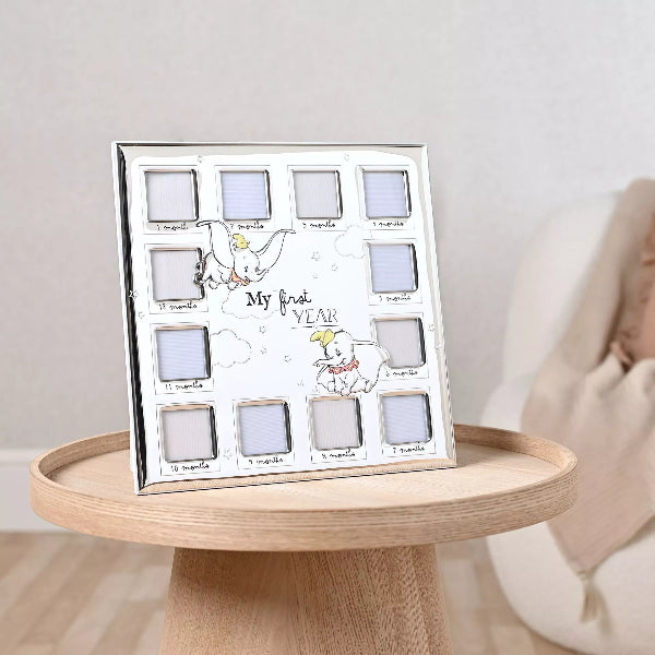 Baby photo album with 12 months of memories on a wooden table.
