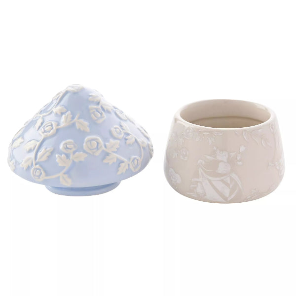 Two ceramic containers, one blue and one beige, with floral patterns on a white background.