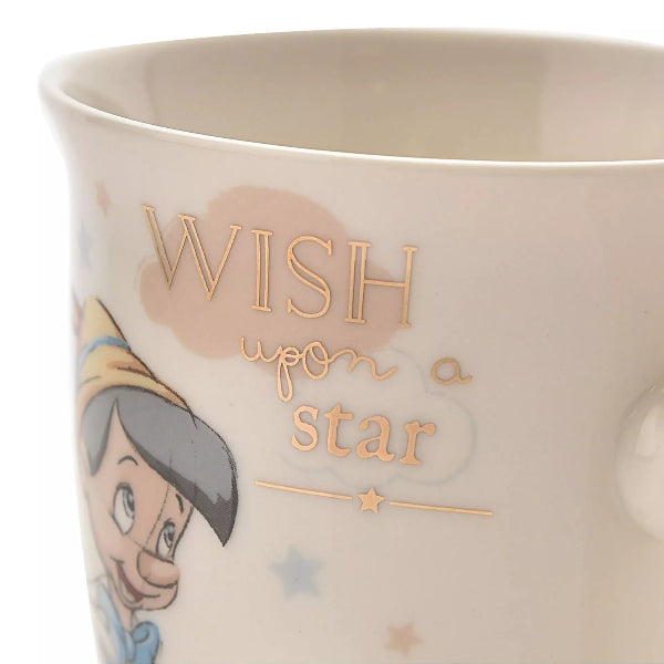 Mug with character design and 'Wish upon a star' text on a white background