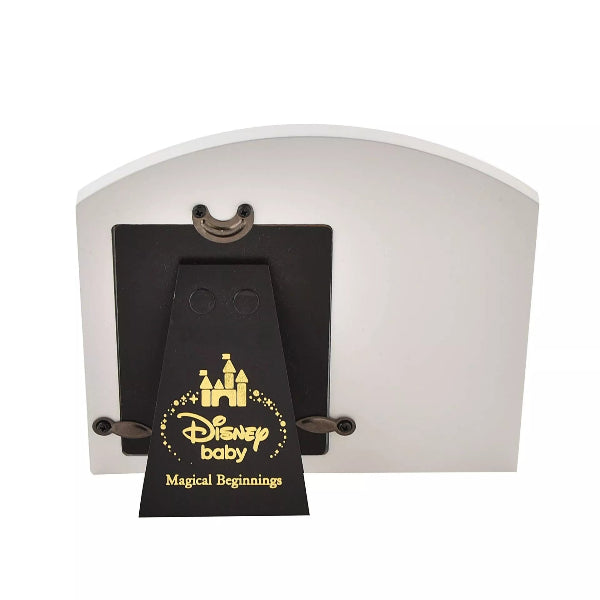 White night light with a black Disney baby tag featuring a castle logo on a white background