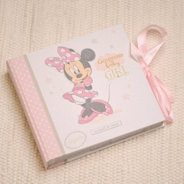 Book with Minnie Mouse design and 'Gorgeous Baby Girl' text on a beige textured background