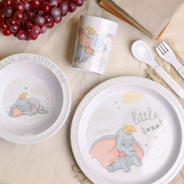 Children's tableware set with Dumbo design on a neutral background