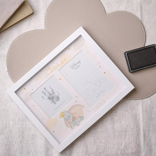Framed baby milestone cards with Dumbo illustration on a heart-shaped mat