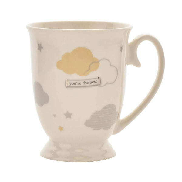 Ceramic mug with cloud and star designs on a white background