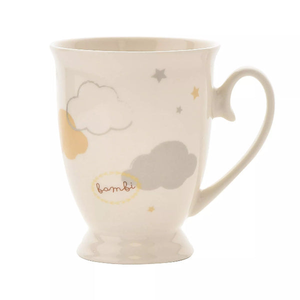 White mug with cloud and star patterns on a white background