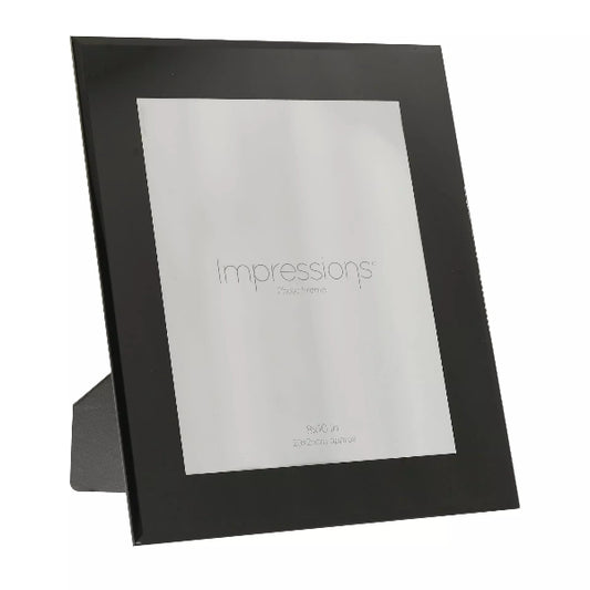 Black photo frame with 'Impressions' branding on a white background