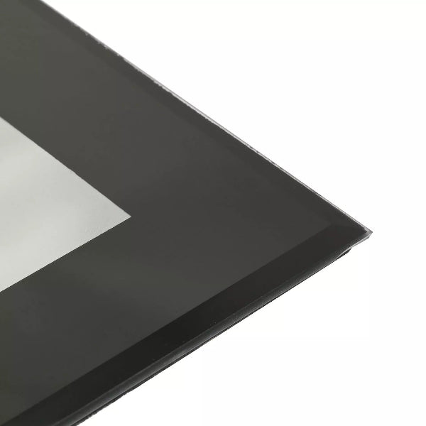 Black rectangular object with a reflective surface on a white background