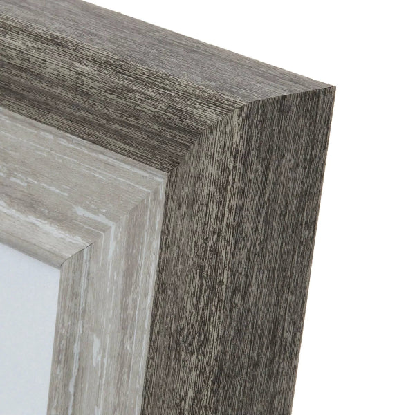 Close-up of a wooden picture frame corner on a white background