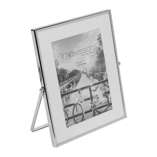 Silver photo frame with a stand holding a black and white photo on a white background