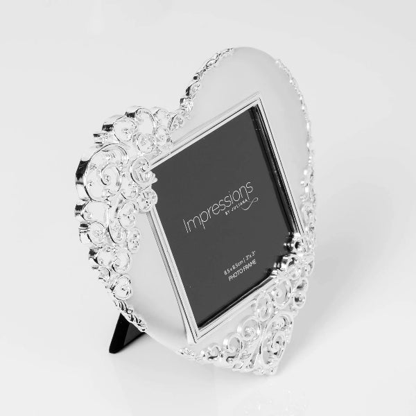 Heart-shaped decorative photo frame with 'Impressions' branding on a white background