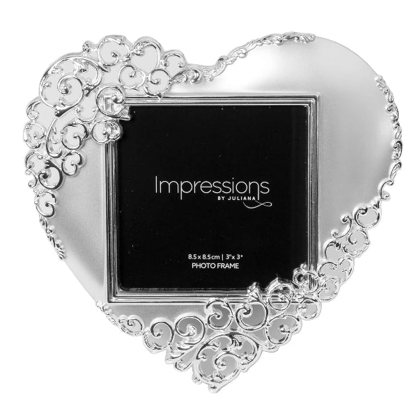 Heart-shaped photo frame with decorative border on a white background