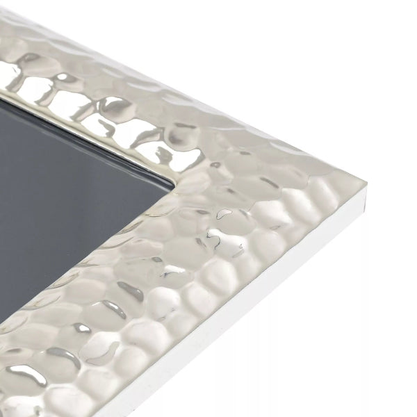 Silver decorative border with textured pattern on a white background