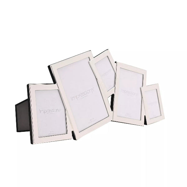 A set of five white picture frames in different sizes, arranged in a fan shape on a plain white background. The frames have a modern angled design with a black base and are branded with the word 'Impressions' printed on the blank white insert.