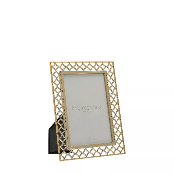 Decorative gold photo frame with lattice design on a white background