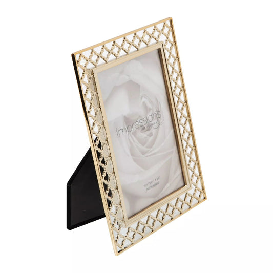 Gold picture frame with a geometric diamond-patterned border and a black triangular stand, shown on a white background.