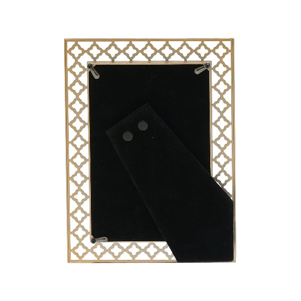Gold decorative frame with a black mat on a white background
