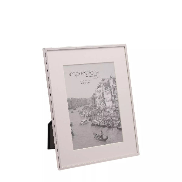 Silver photo frame with a scenic image on a white background