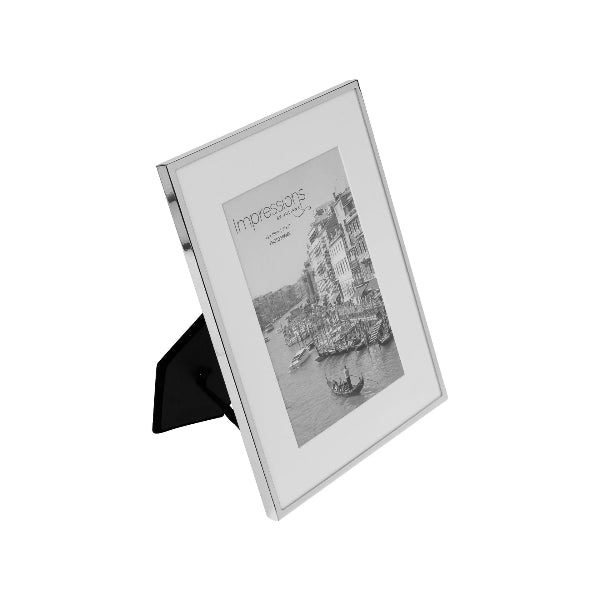 Silver photo frame with a black and white image of a cityscape on a white background
