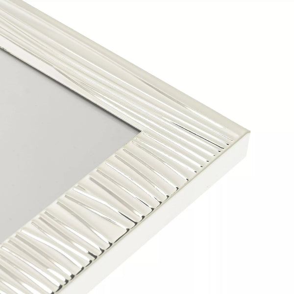 Silver rectangular frame with a ribbed texture on a white background