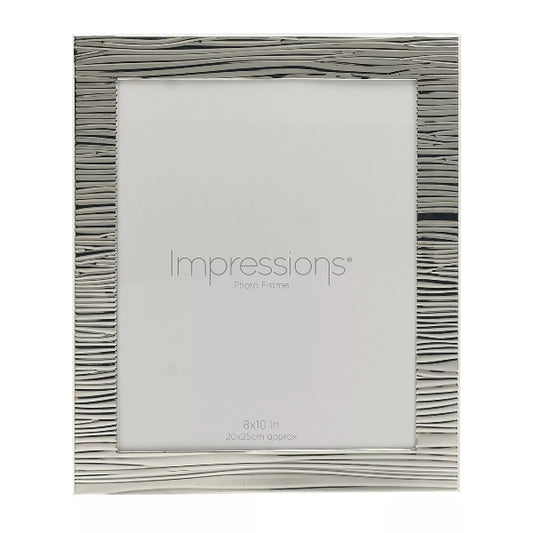 Silver photo frame with wavy design on a white background