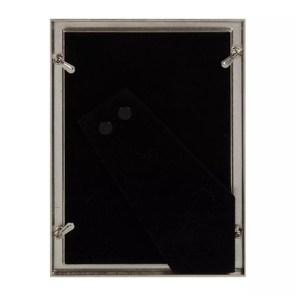 A rectangular black velvet or felt display panel with a silver-toned metal frame and four corner clips, shown against a plain white background.
