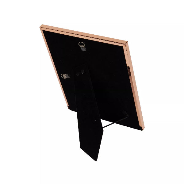 Black rectangular object with a rose gold border on a white background