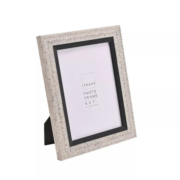 A 5x7 inch standing picture frame with a textured light gray wood-grain finish and a black inner border, shown on a plain white background.