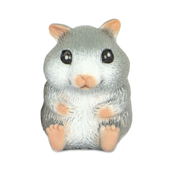Small figurine of a gray hamster with black eyes on a white background