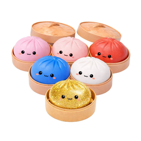 Colorful dumpling-shaped products with cute faces in a wooden box on a white background
